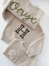 Load image into Gallery viewer, onyx in army + blush heart, H in pine, Evie in Ballerina. All regular yarn
